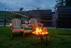Luxury ensuite glamping pods fire pit and outdoor seating