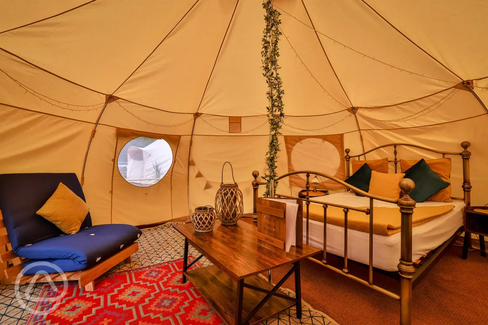 Bell tent interior with double bed Bell tent interior with double bed