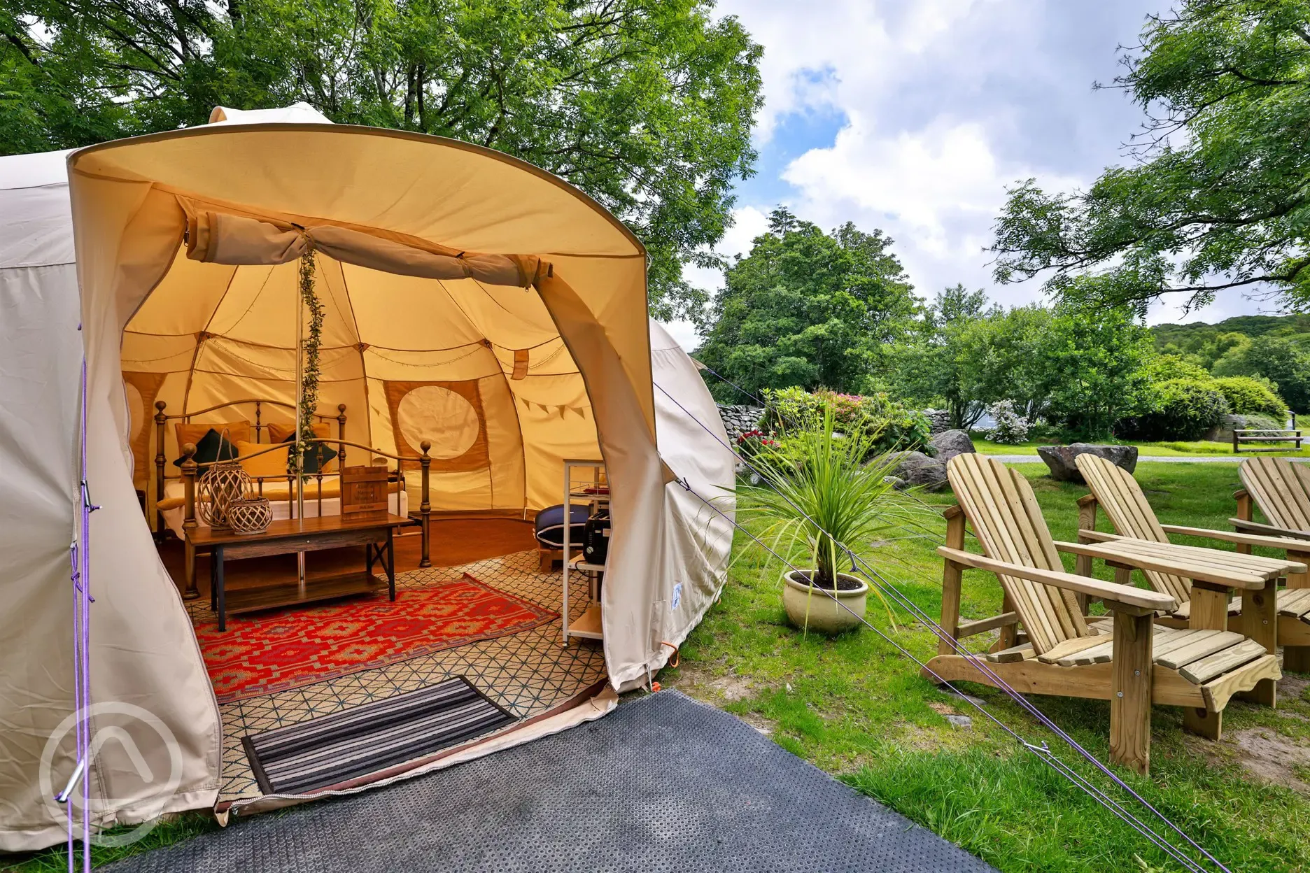 Bell tent exterior with outdoor seating Bell tent exterior with outdoor seating