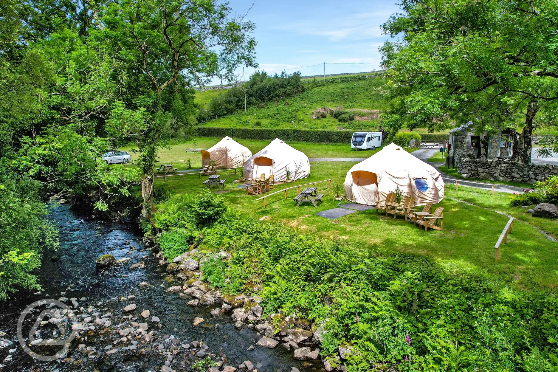 Bell tents by the river