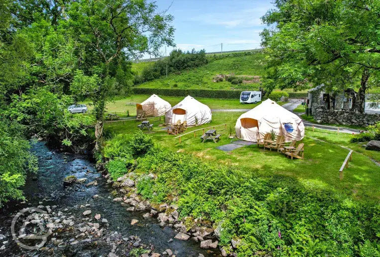 Bell tents by the river