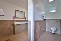 Toilets with mirrors and sinks Toilets with mirrors and sinks