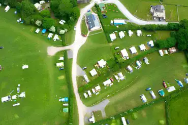 Bird's eye view of the campsite with hedges diving fields