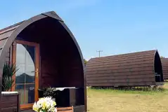 Glamping pods exterior with outdoor seating Glamping pods exterior with outdoor seating