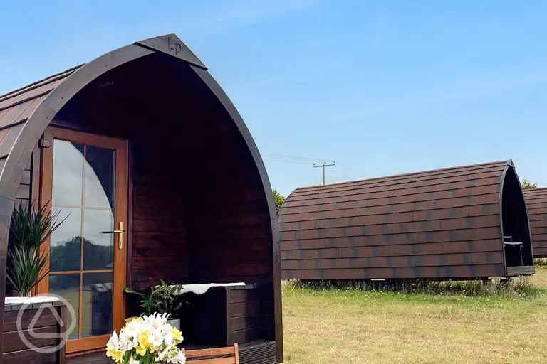 Glamping pods exterior with outdoor seating