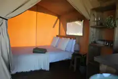 Safari tent bedroom with double bed Safari tent bedroom with double bed