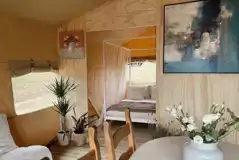 Safari tent bedroom and living area Safari tent bedroom and living area