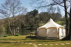 Unfurnished 5m bell tent with a lakeside view