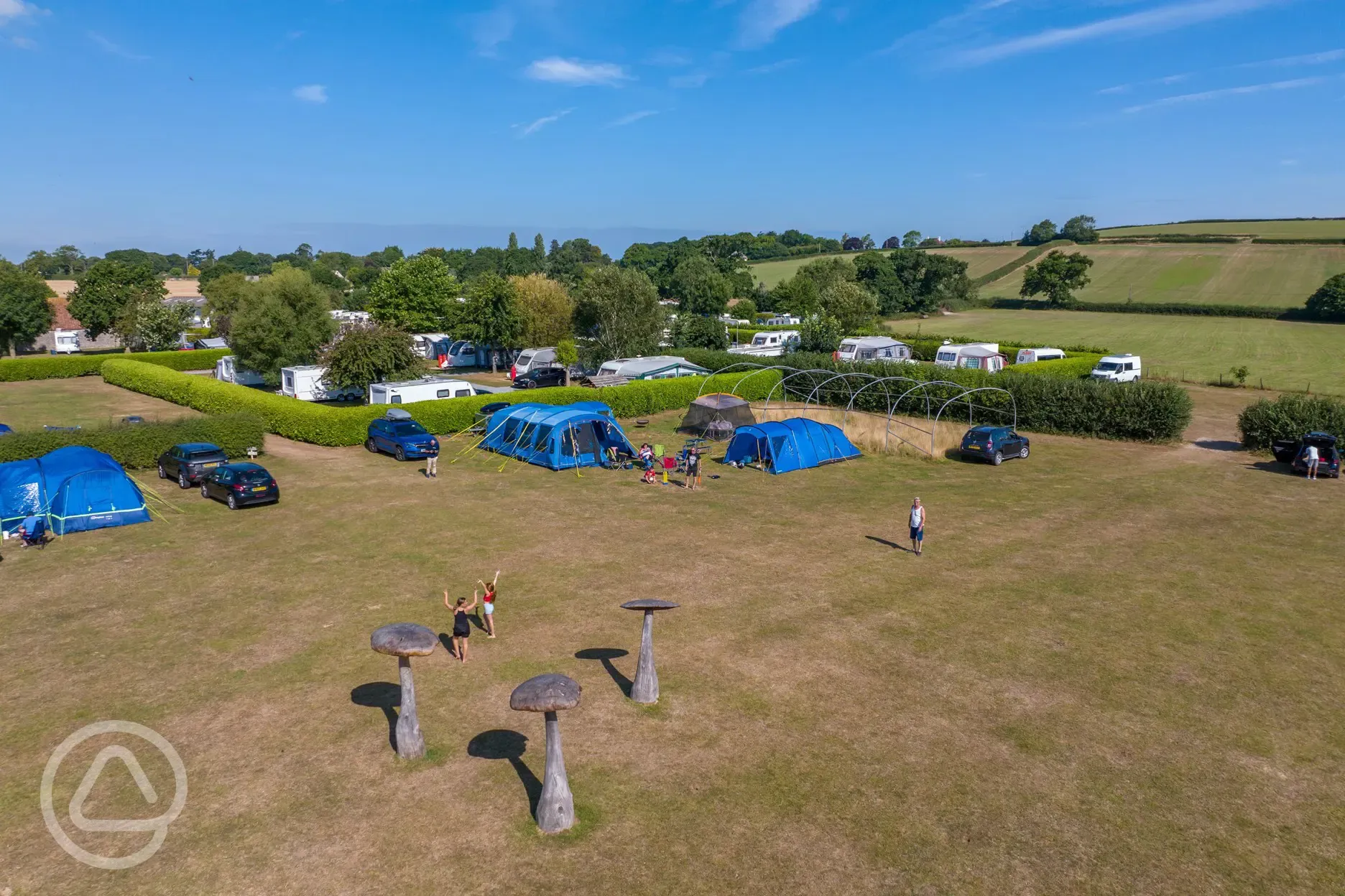 Aerial of the grass pitches and mushroom sculptures 