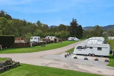 Hardstanding and grass pitches with views of the Peak District