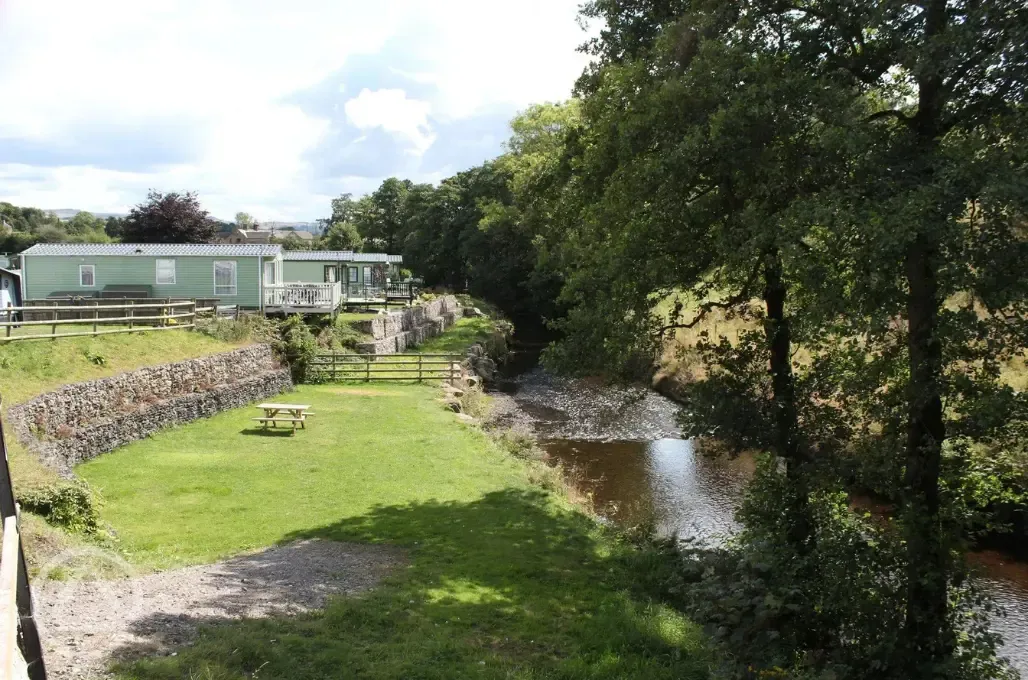 Picnic benches by the River Noe