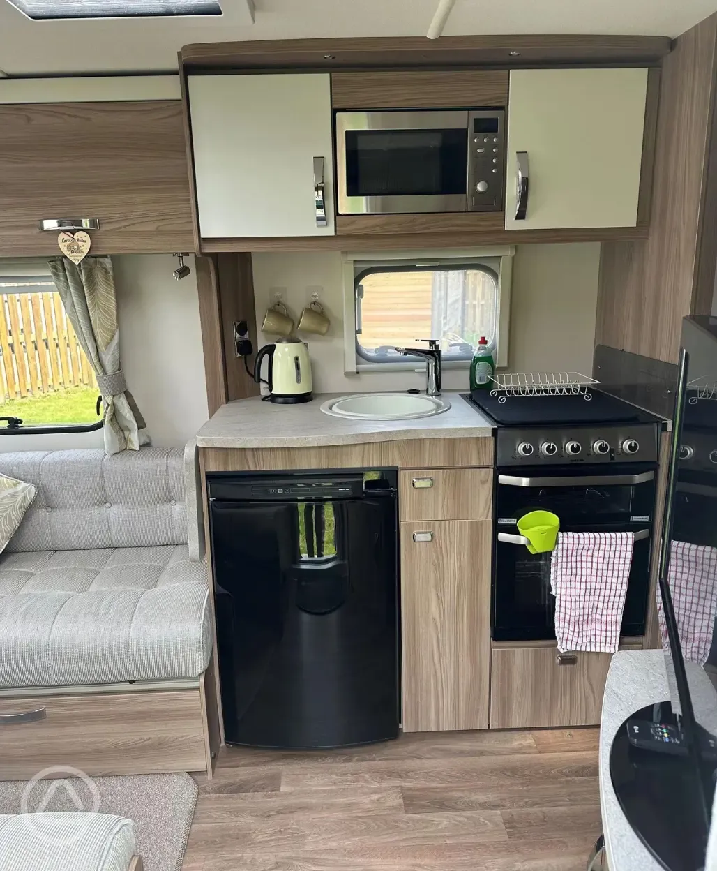 Ursula caravan interior kitchen with fridge, oven and hob