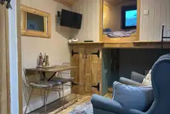 Jack's shepherd's hut interior with double bed and day bed Jack's shepherd's hut interior with double bed and day bed