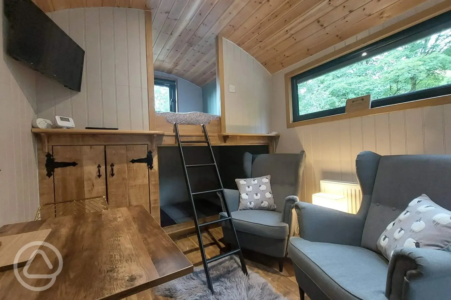 Jack's shepherd's hut interior with sofa and smart tv