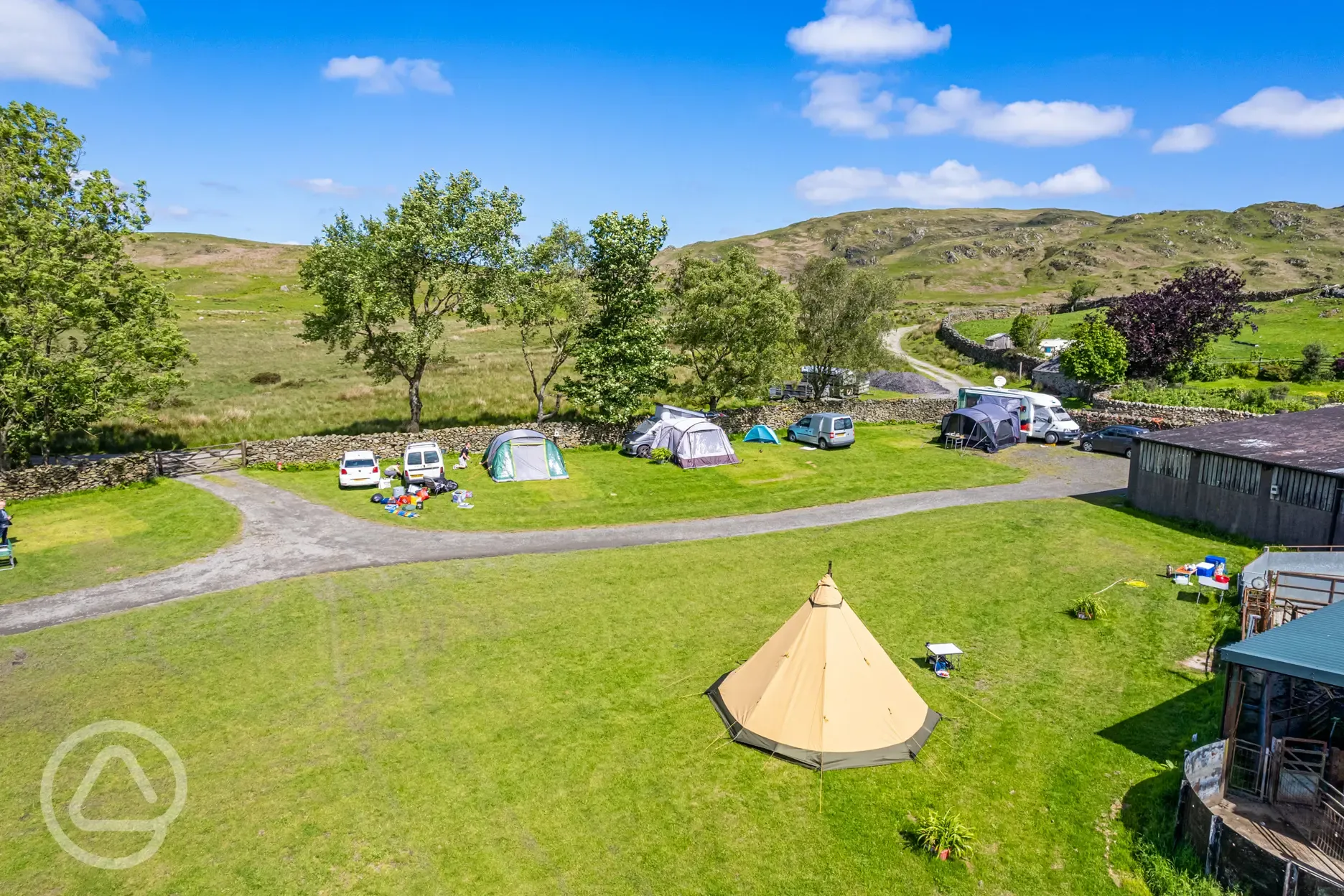 Tents on electric grass pitches at Birchbank Camping Site (10 amp hook up)