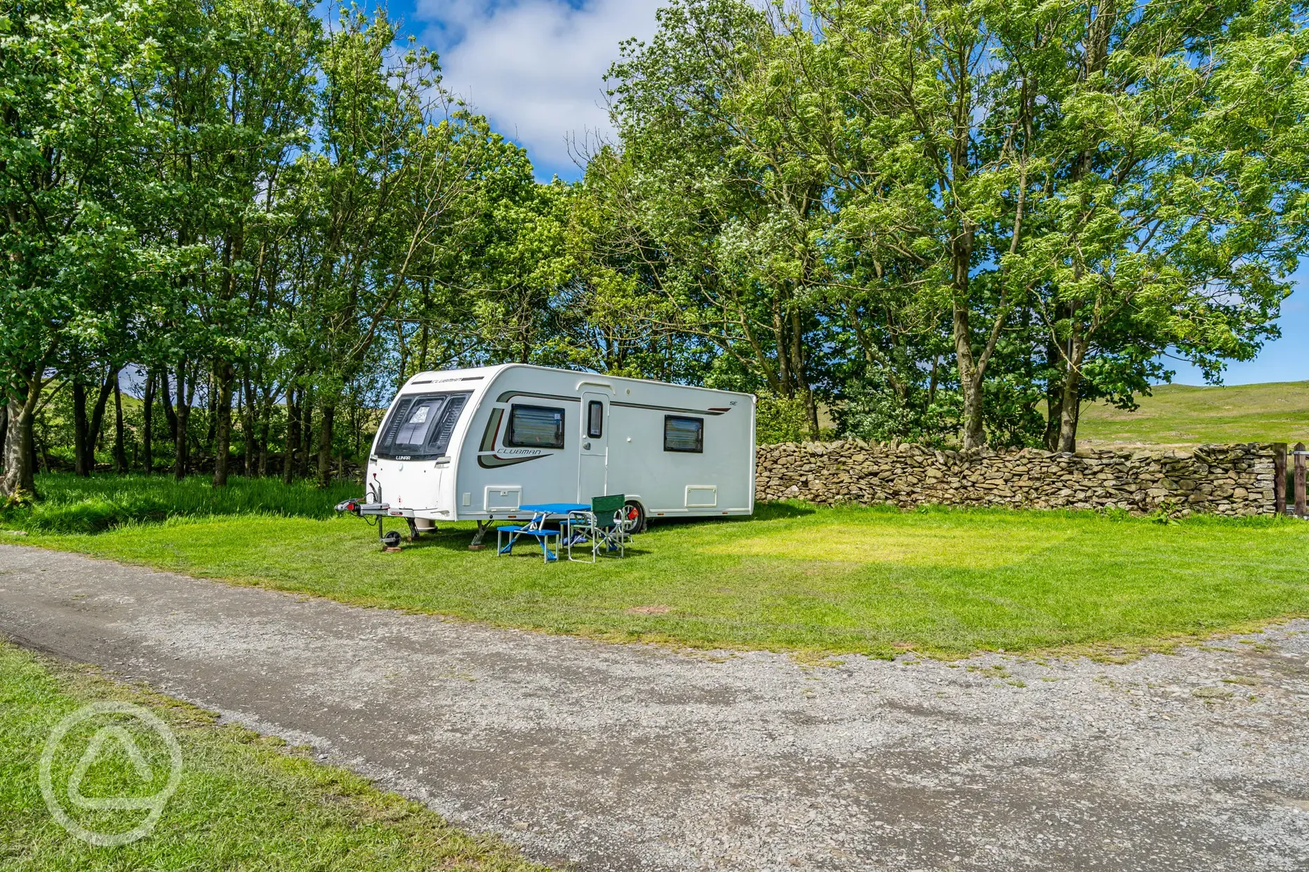 Caravan on electric grass pitches at Birchbank Camping Site (10 amp hook up)