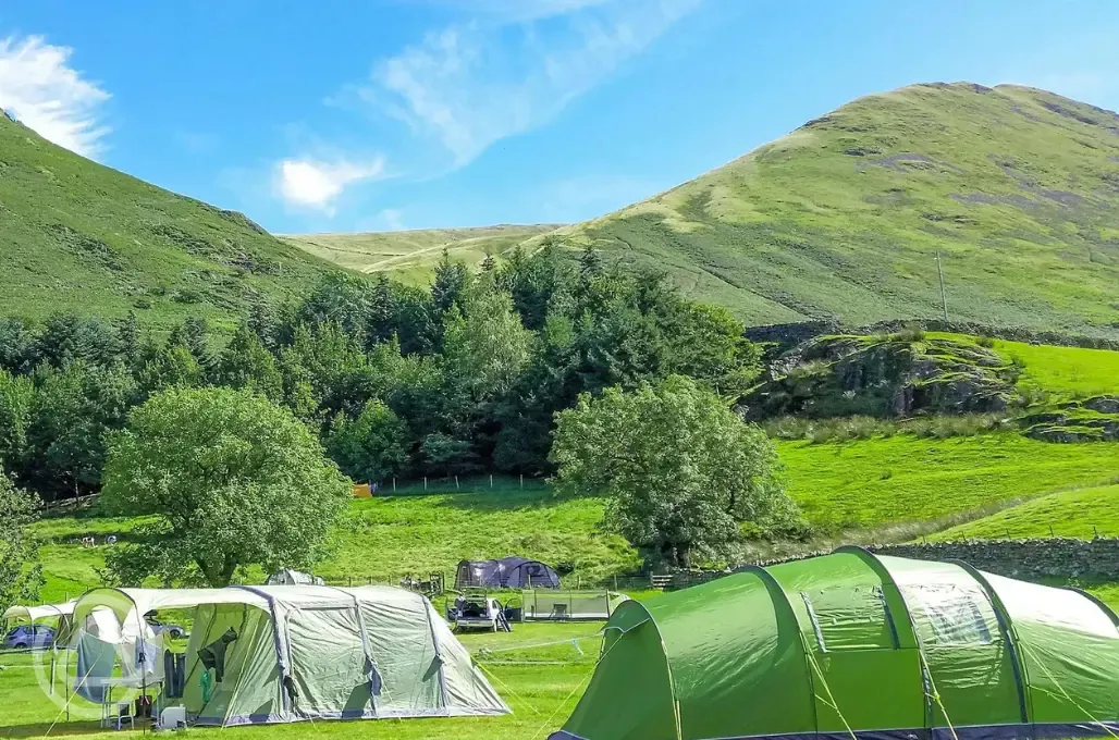 Non electric grass pitches with mountain views