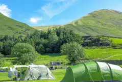 Non electric grass pitches with mountain views Non electric grass pitches with mountain views