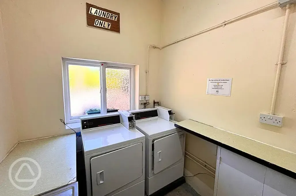 Laundry room with washers and dryers (token operated)