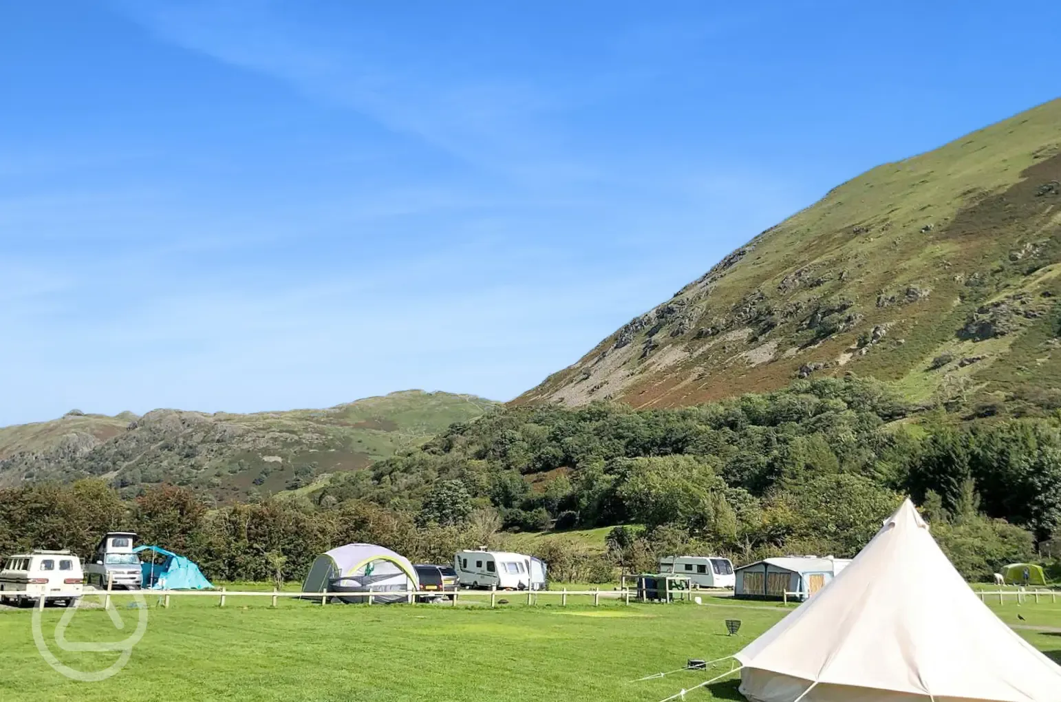 Non electric grass pitches with mountain views
