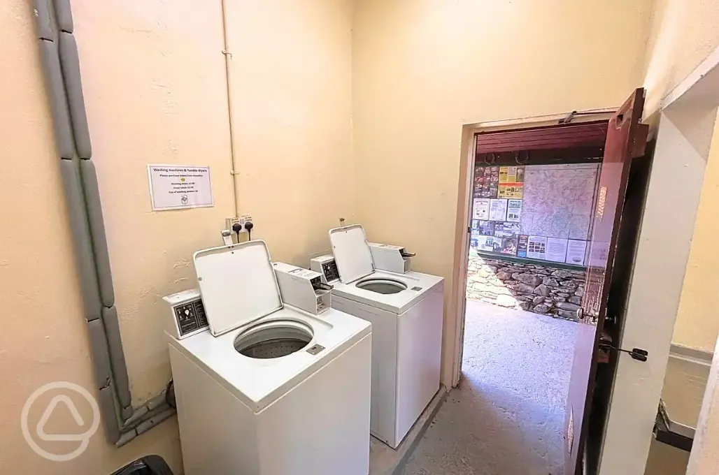 Laundry room with washers and dryers (token operated)