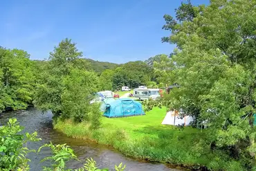Non electric grass tent pitches (5m x 4m) by the riverside