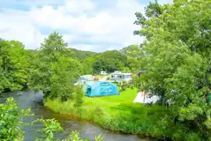 Non electric grass tent pitches (5m x 4m) by the riverside