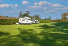 Grass pitches in Eeyore's Paddock (hiker and electric pitch options)
