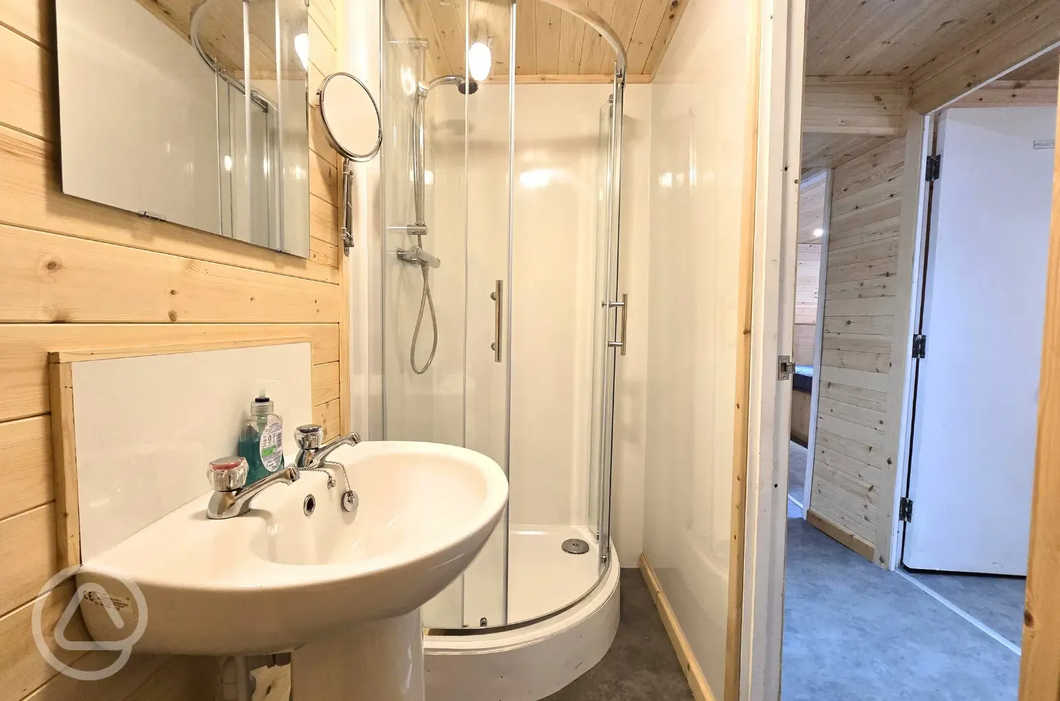 Silver Birch lodge ensuite bathroom with a shower, toilet, and sink