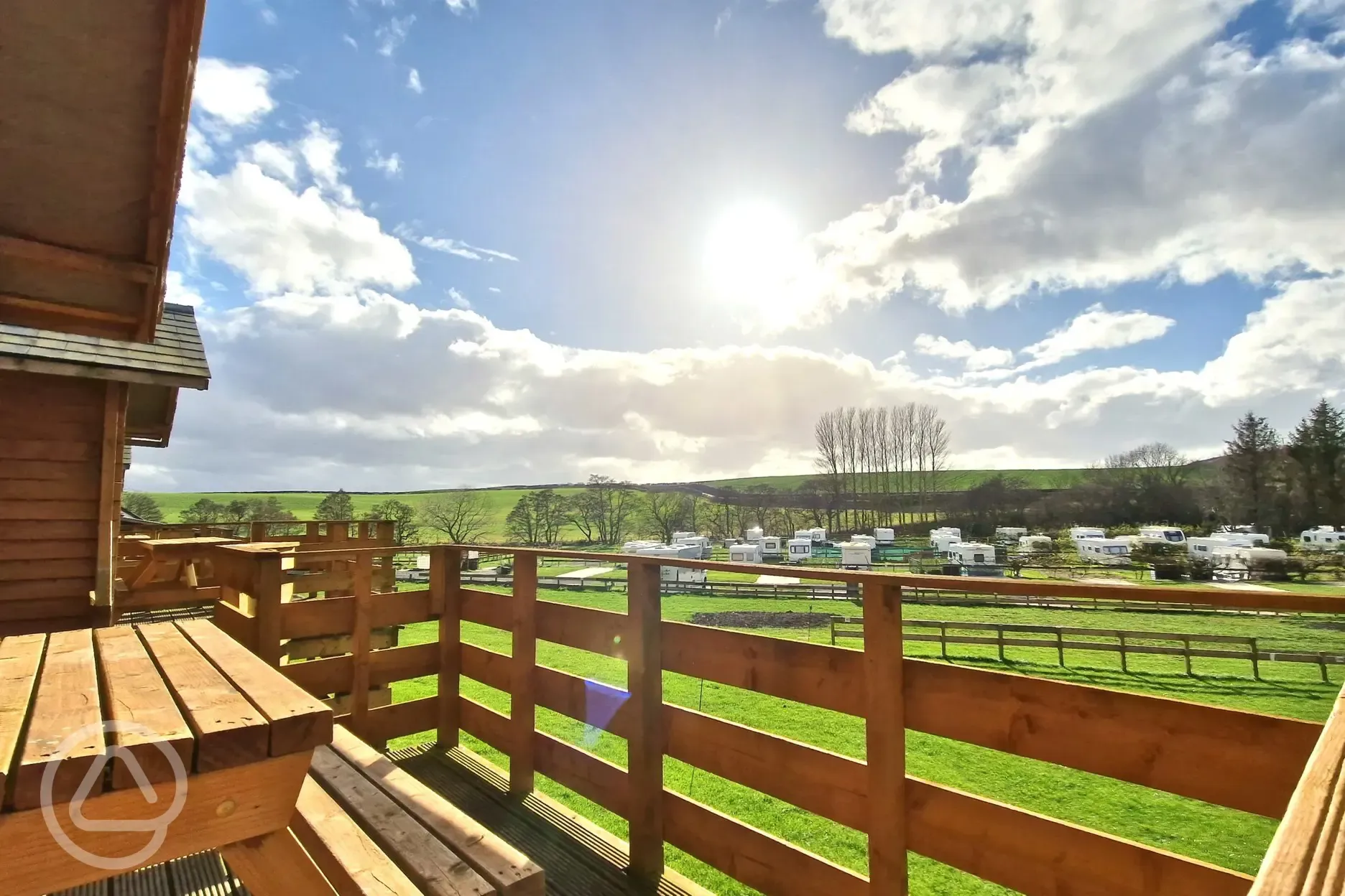 Hill View hut balcony overlooking the touring pitches