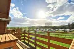 Hill View hut balcony overlooking the touring pitches