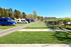 Hardstanding pitches with 16 amp optional electric at Budle Bay Campsite