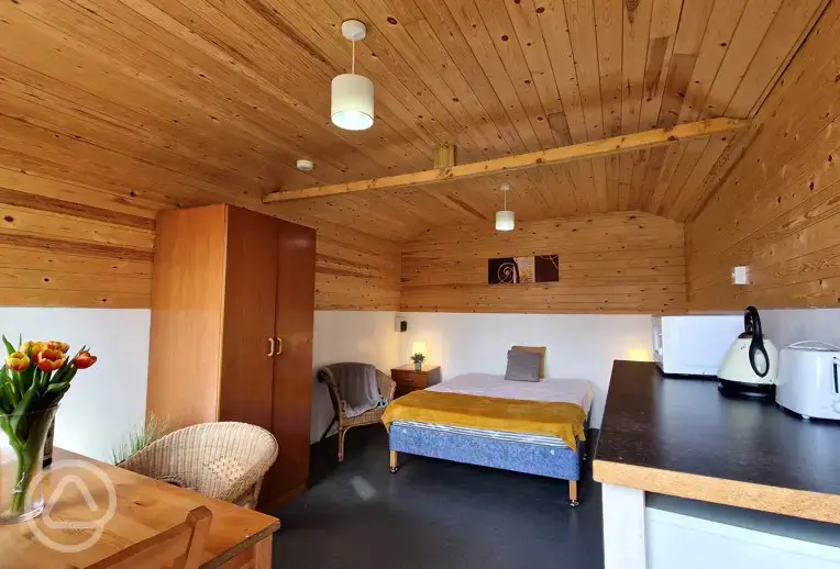 Two person Hill View huts at Budle Bay with a double bed and kitchenette