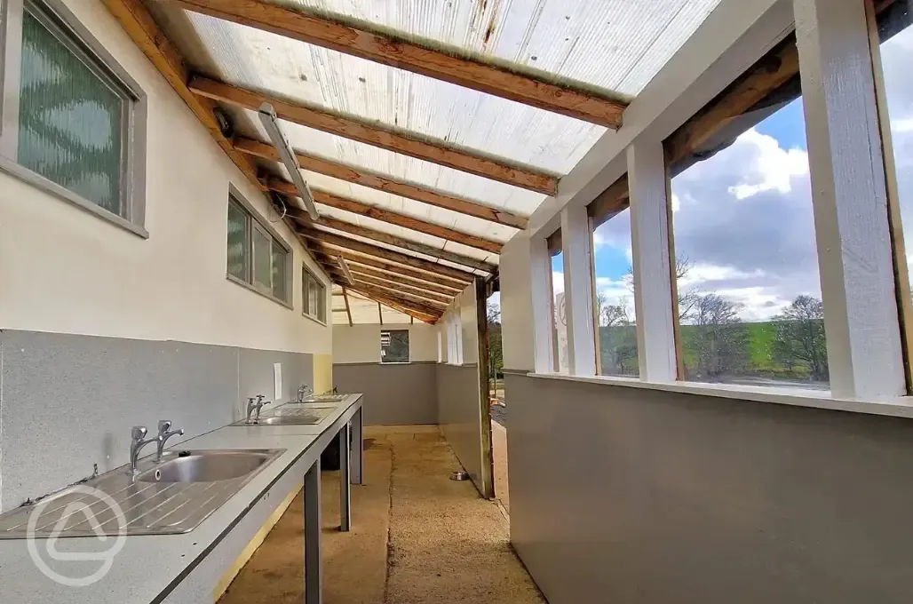 Covered outdoor washing up area