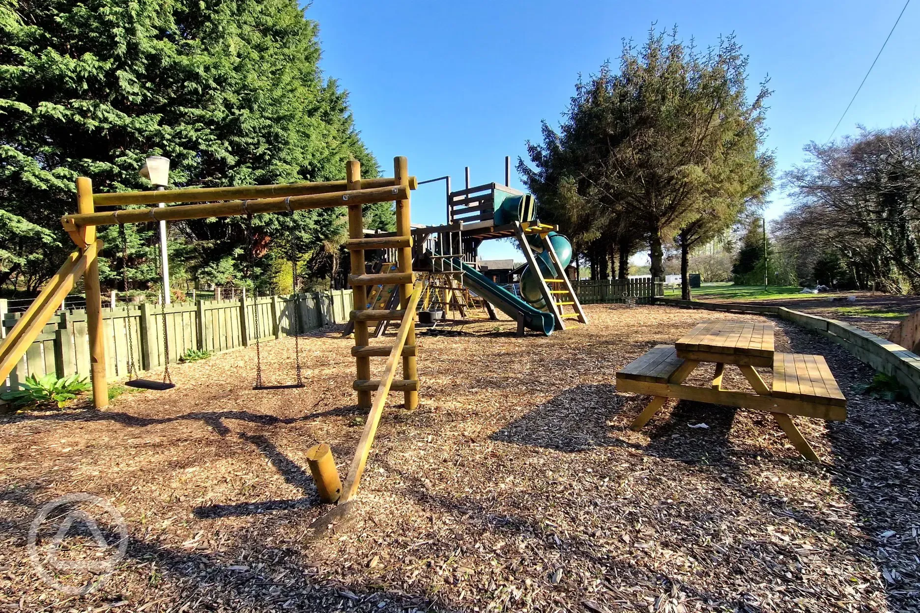 Play park with swings, climbing frames, and slides