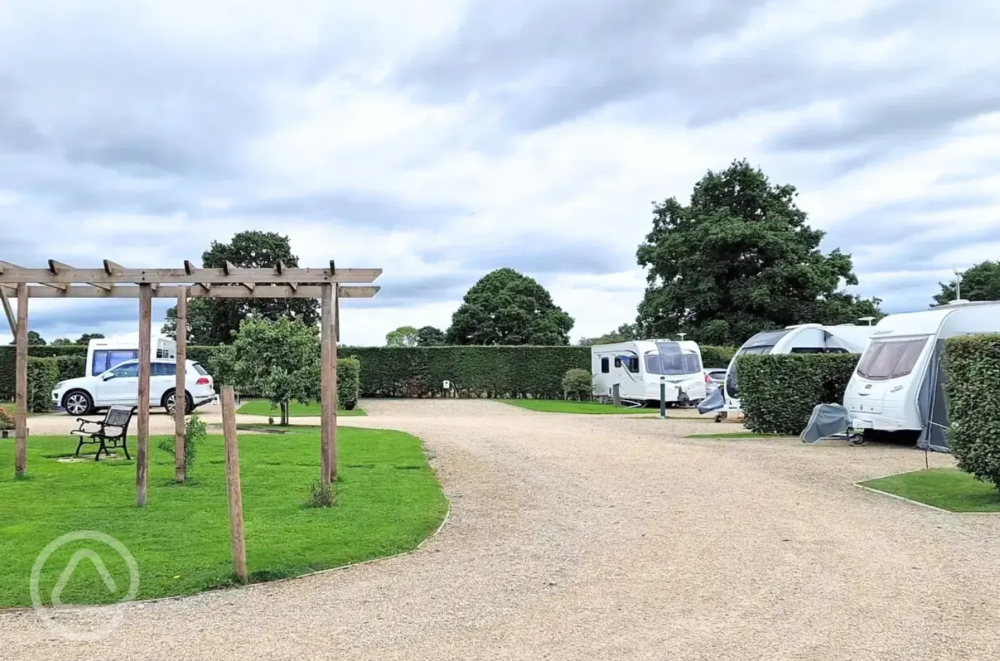 Fully serviced hardstanding pitches with grass area