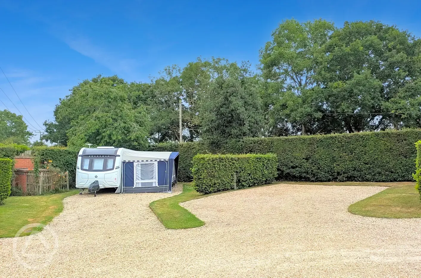 Fully serviced hardstanding pitches with grass area