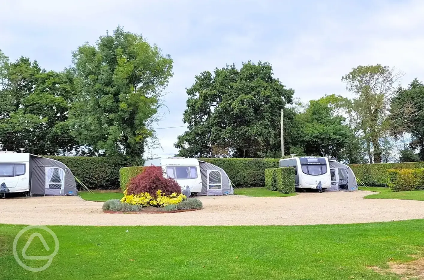 Fully serviced hardstanding pitches with grass area