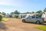 Fully serviced hardstanding pitches with grass area