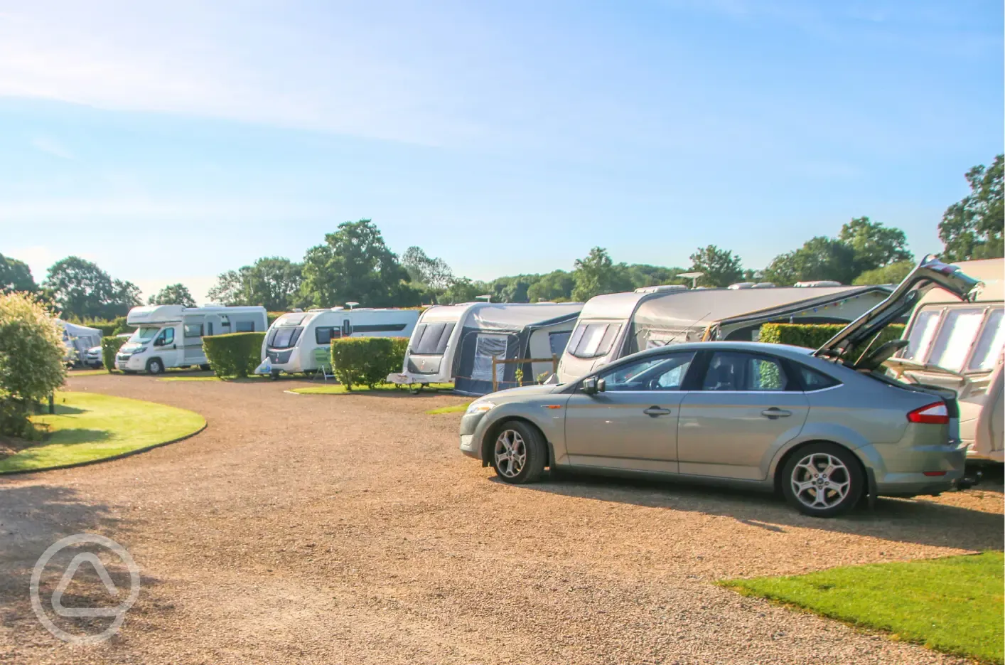 Fully serviced hardstanding pitches with grass area