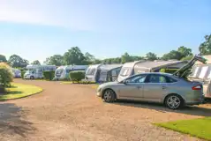 Fully serviced hardstanding pitches with grass area