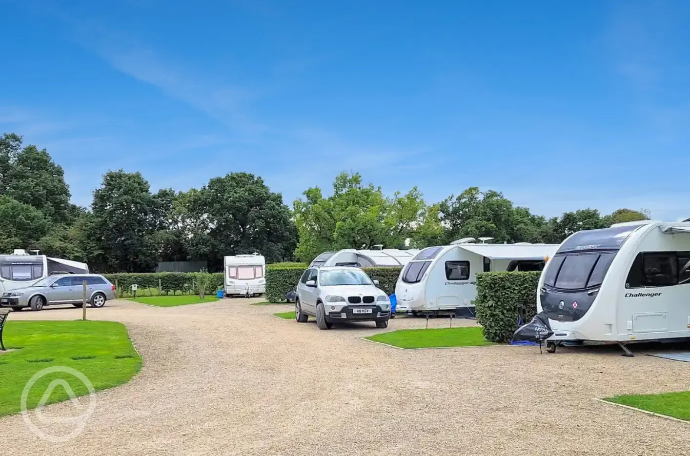 Fully serviced hardstanding pitches with grass area