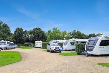 Fully serviced hardstanding pitches with grass area
