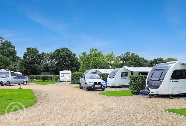 Fully serviced hardstanding pitches with grass area