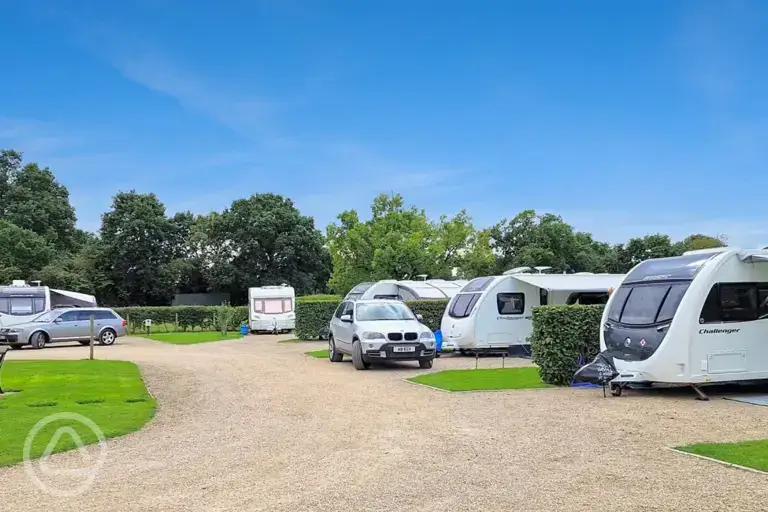 Fully serviced hardstanding pitches with grass area