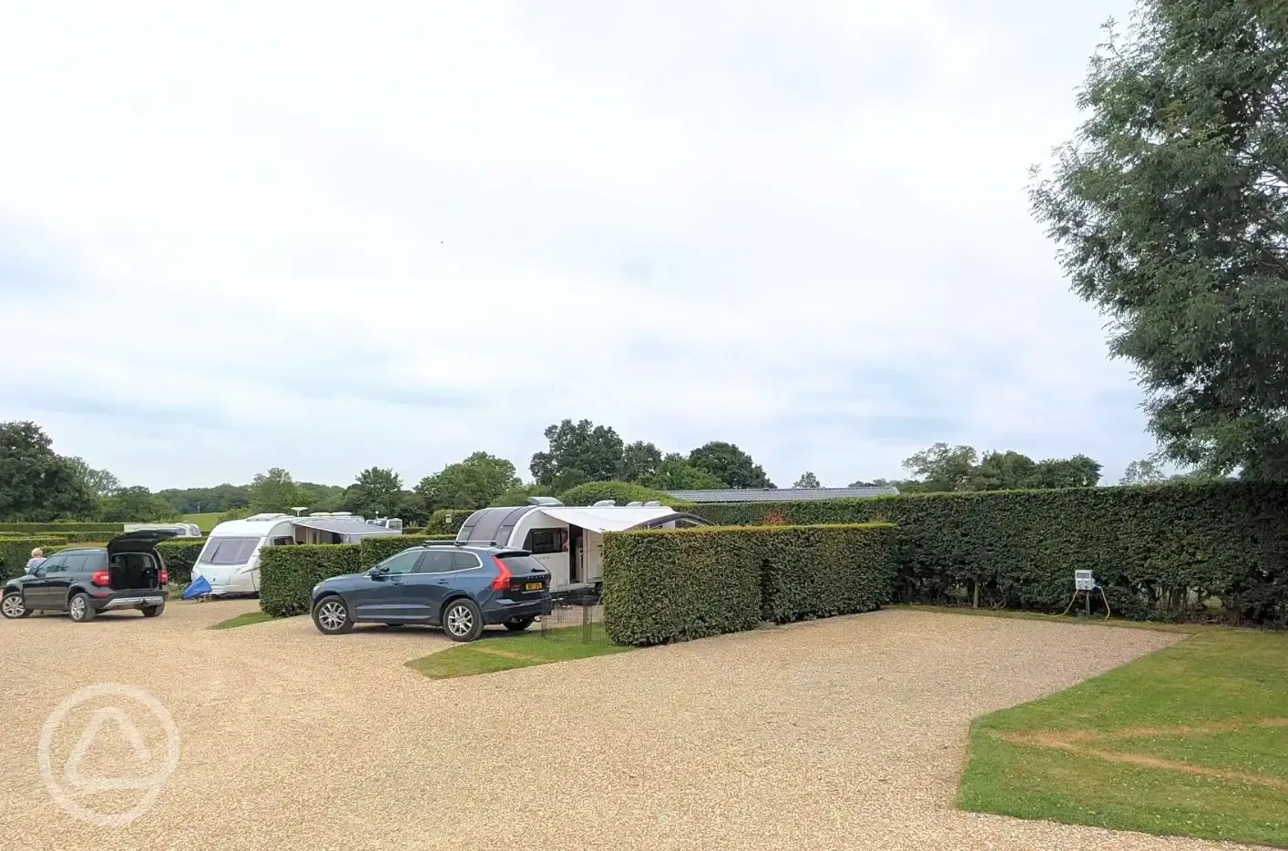 Fully serviced hardstanding pitches with grass area