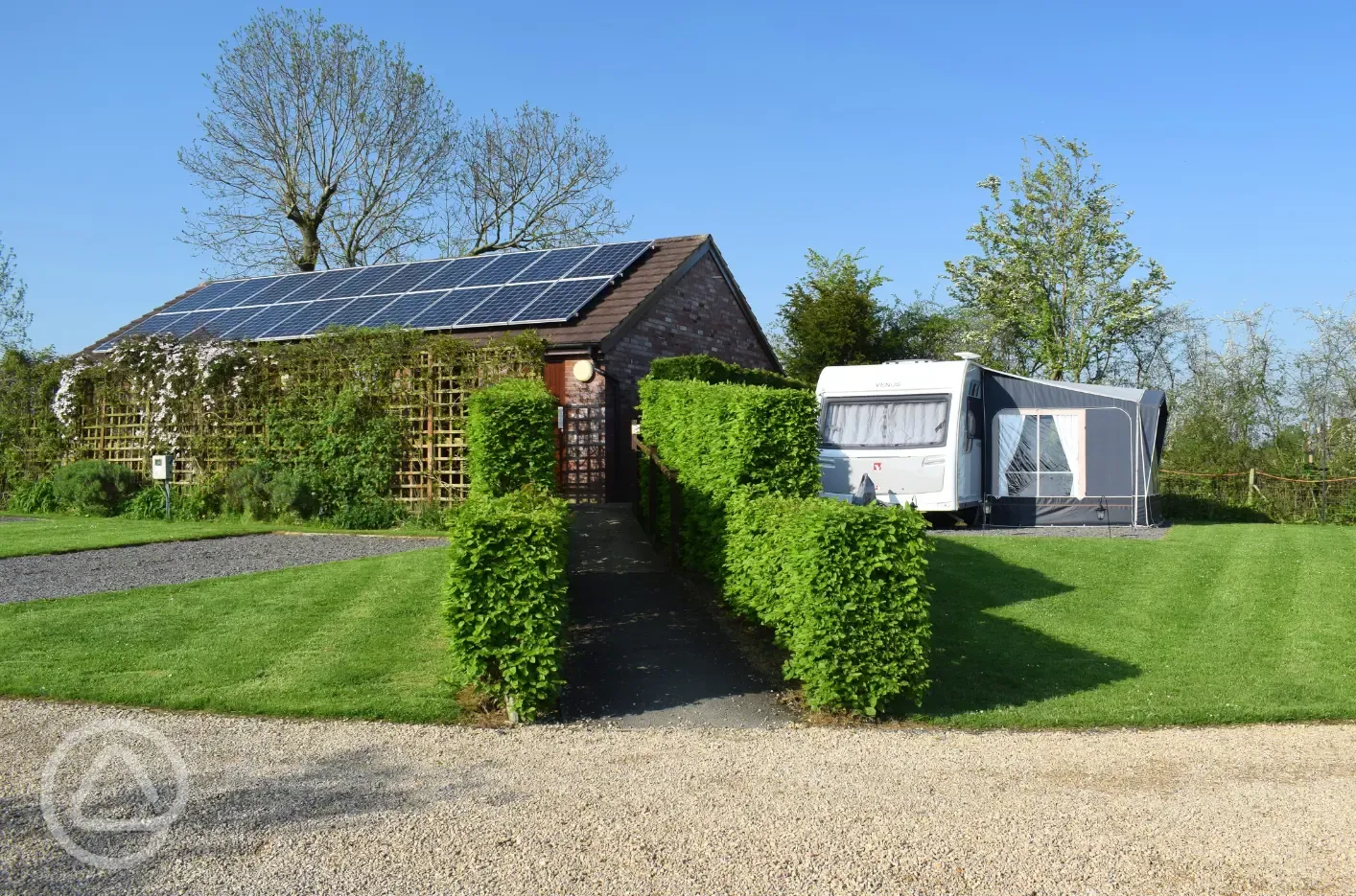 Fully serviced hardstanding pitches with grass area