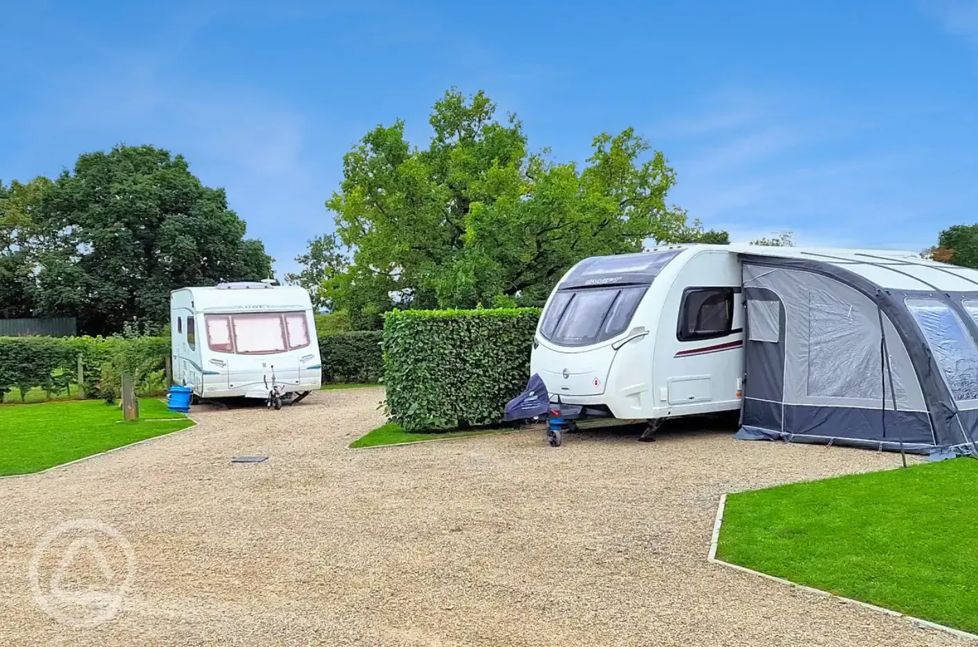 Fully serviced hardstanding pitches with grass area