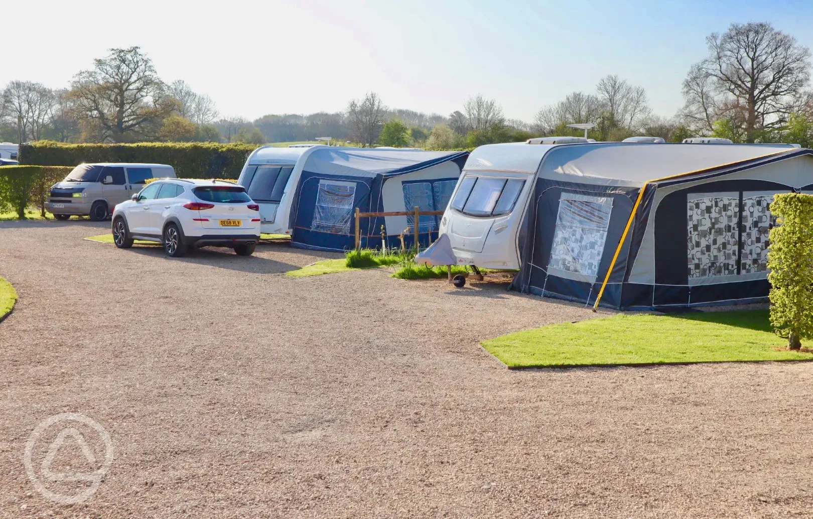 Fully serviced hardstanding pitches with grass area