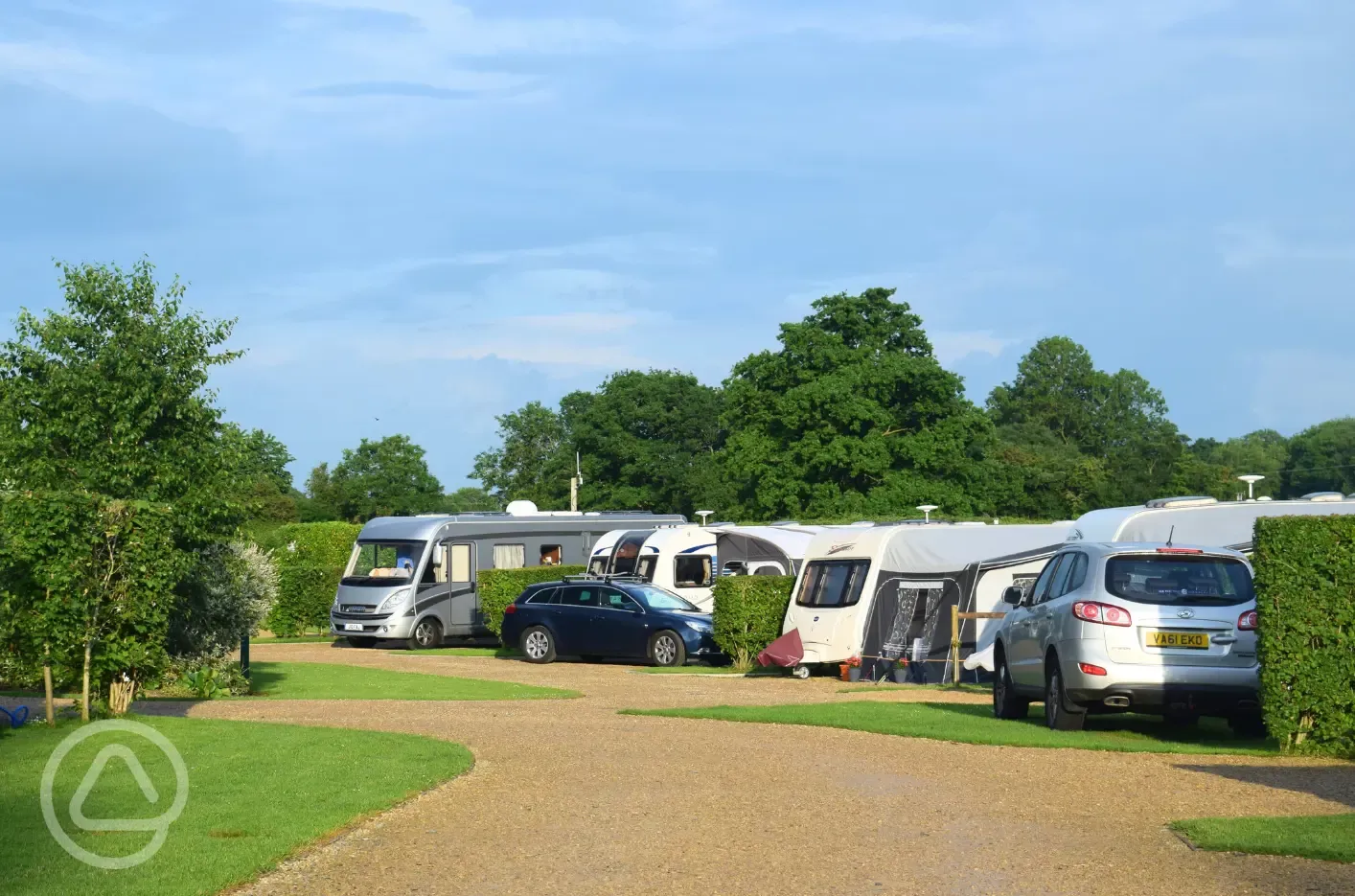 Fully serviced hardstanding pitches with grass area